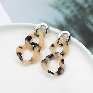 Elegant amber and dark brown resin link drop earrings with polished silver metal top
