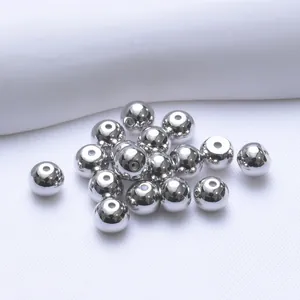 Detailed view of 5mm 18K gold plated silver sphere earring backs with silicone core
