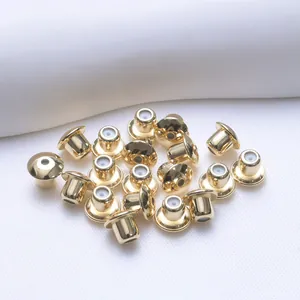 Detailed view of 18K gold-plated 5mm ball earring backs with silicone inserts for DIY