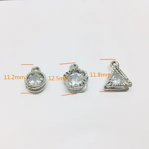 Detailed size comparison of three silver alloy heart and round zircon jewelry charms