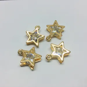 Set of four gold alloy star pendants with inlaid round clear zircon stones for DIY jewelry
