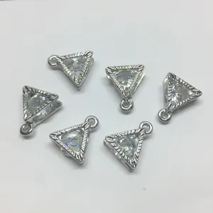 Detail of six triangle alloy pendants with inlaid zircon and fine engraved edges