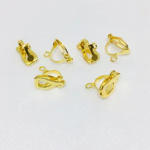 Detail of six gold-plated non-pierced earring converter clips for DIY jewelry making