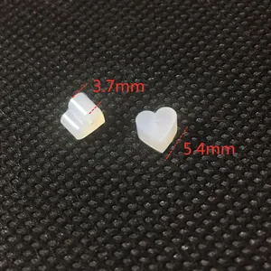 Macro view of heart-shaped silicone earring backs in 3.7mm and 5.4mm sizes