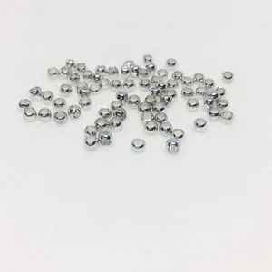 Bulk set of silver plated positioning beads for DIY jewelry making on white background