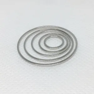 Detailed view of five nesting flat silver metal rings for DIY jewelry making