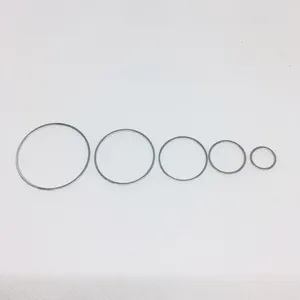 Set of five polished silver metal rings in varying diameters for jewelry making