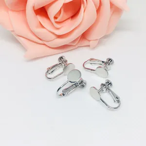 Macro shot of silver-plated screw earring converters for DIY jewelry making