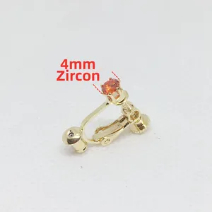 Detalle de circón naranja de 4mm en clip de oreja dorado para orejas sin perforar