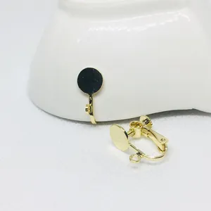 Close-up of gold-plated screw ear clip converter for non-pierced DIY jewelry making
