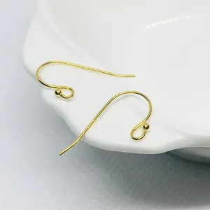 Macro detail of 18k gold plated S925 sterling silver ear hooks with ball accents