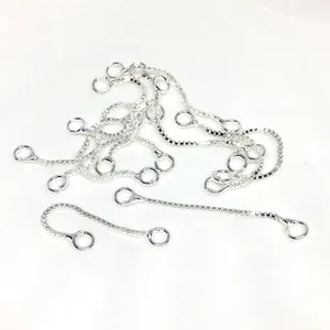 Close-up of 0.8mm silver box chains with round jump rings for DIY earring making