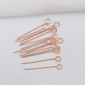 Close-up of 14k gold-filled rose gold eye pins for DIY jewelry making and beading