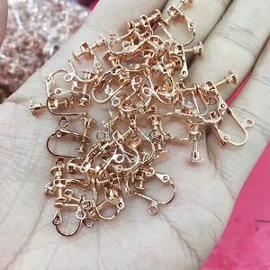 Close-up of rose gold screw clip-on earring converters for DIY handmade jewelry making
