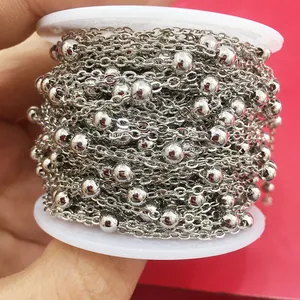 Polished silver beaded satellite chain for DIY jewelry making wound on a spool