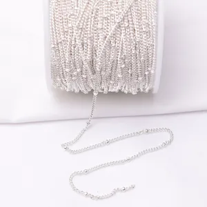 Macro detail of silver plated bead chain roll for DIY jewelry making accessories