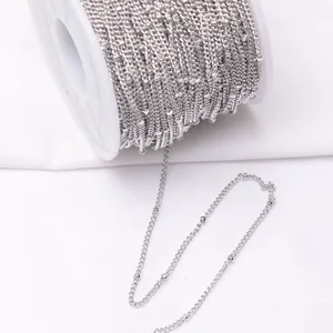 Silver satellite chain on a white spool for DIY jewelry making and handmade crafts
