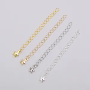 Close-up of four 14K gold and silver plated extension chains with star pendants