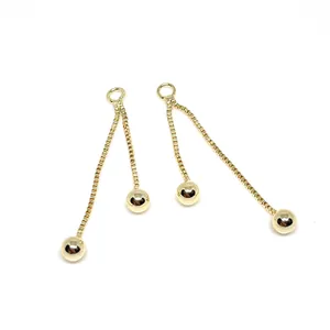 14k gold-filled tassel earrings featuring double box chains with polished golden bead charms