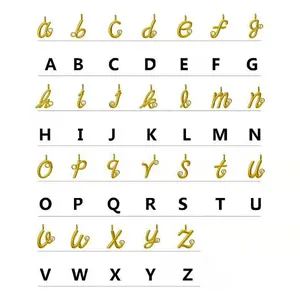 Macro view showing 26 cursive 14k gold-filled letter pendants with zircon accents