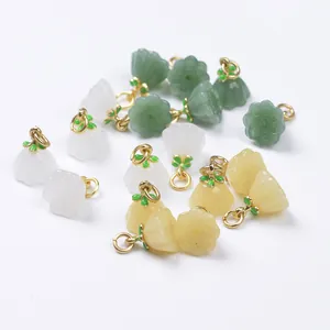 Detail of colorful lotus flower pendants with gold hooks for DIY jewelry making