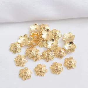 Detail of 14k gold-plated flower bead caps with six petals for DIY jewelry making