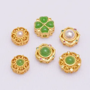 Detailed close-up of antique gold finish beads with emerald stones and pearls for DIY jewelry