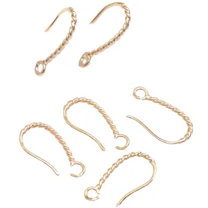 Five 14K gold filled twisted ear hooks for DIY jewelry making on white background