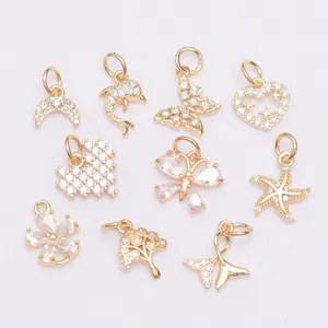 Macro view of ten 14K gold plated charms with cubic zirconia for DIY jewelry making