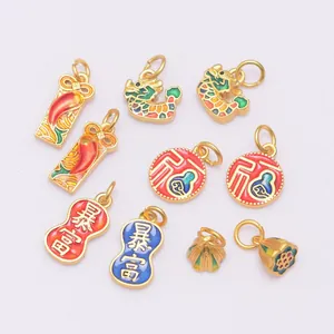 Detailed view of various gold-plated enamel pendants with traditional Chinese patterns
