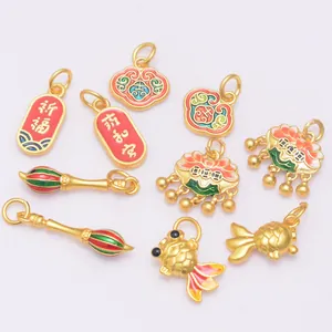 Set of nine traditional Chinese gold charms with auspicious patterns and enamel details