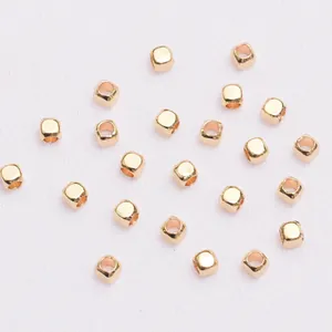 Close-up of square 18K gold plated spacer beads for DIY jewelry making and crafts