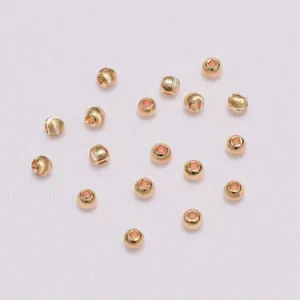 Macro shot of 18K gold plated textured spacer beads with spiral pattern for DIY jewelry