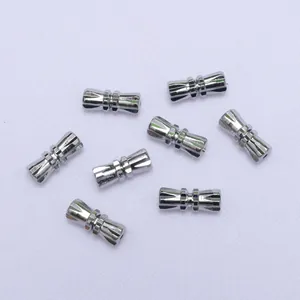Macro detail of seven silver screw clasps for DIY jewelry making and bracelet connectors