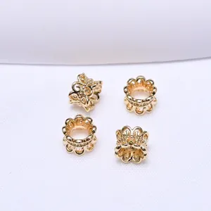 Detail view of 18k gold plated hollow flower spacer beads for DIY jewelry making