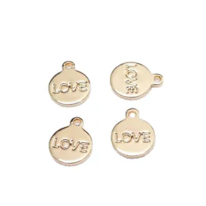 Polished 14k gold-plated round metal pendants with LOVE engraving for DIY jewelry