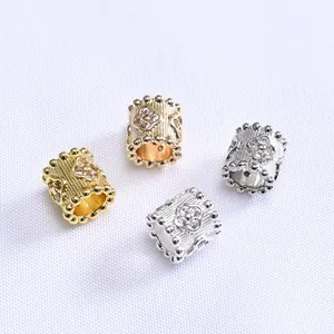 Macro de cuentas espaciadoras cilíndricas en oro 14K y plata con trébol de circón