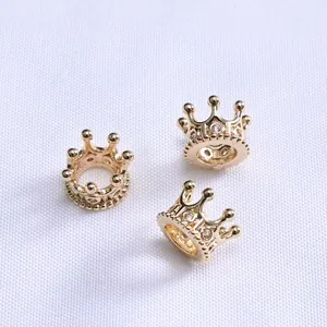 Macro detail of 14K gold plated crown spacer beads with micro-pave cubic zirconia crystals