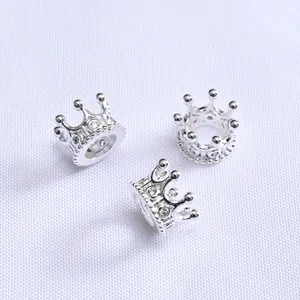 Detail of three silver 14K gold-plated crown spacers with micro-set zircon for DIY jewelry