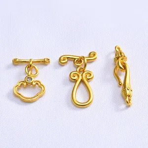 Macro shot of 14K gold plated Ruyi cloud OT toggles and connectors for jewelry making