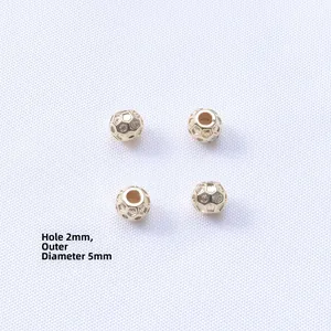 Macro view of 14K gold filled spacer beads with cubic zirconia and 2mm hole for DIY jewelry