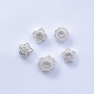 Silver-plated four-leaf clover and flower spacer beads with embedded zircon crystals