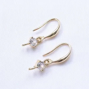 Macro shot of 14K gold plated earring hooks with sparkling cubic zirconia stones