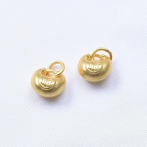 Pair of matte gold Fu pendant charms with traditional heart design for DIY jewelry making
