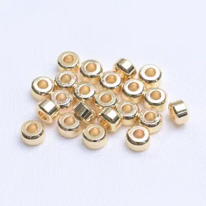 Detailed macro shot of 18k gold plated spacer beads for DIY jewelry making