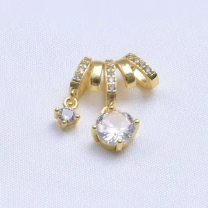 Macro view of 14k gold-filled charms with micro-pave zircons for DIY jewelry making