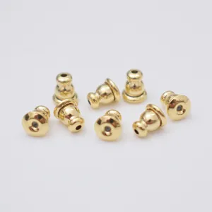 Set of 8 gold bullet earring backs made of 14k gold-plated metal with silicone inserts