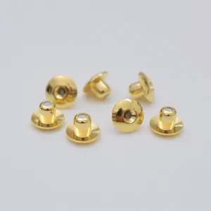 Macro view of 14K gold-plated earring backs with silicone core in disc design