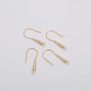 Detailed view of four 14k gold-plated earring hooks for handmade DIY jewelry making