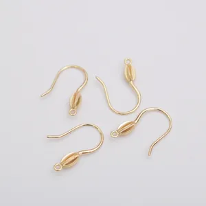 Close-up of 14k gold-filled french ear hooks with micro-pave zircon and small hanging rings
